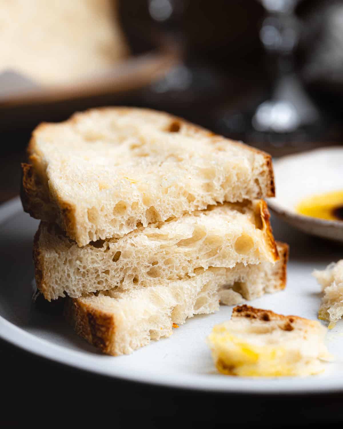 Stack of sliced bread on a plate. 