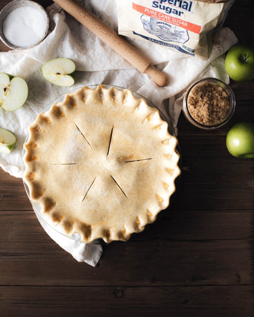 Unbaked apple pie scored to release steam during baking 