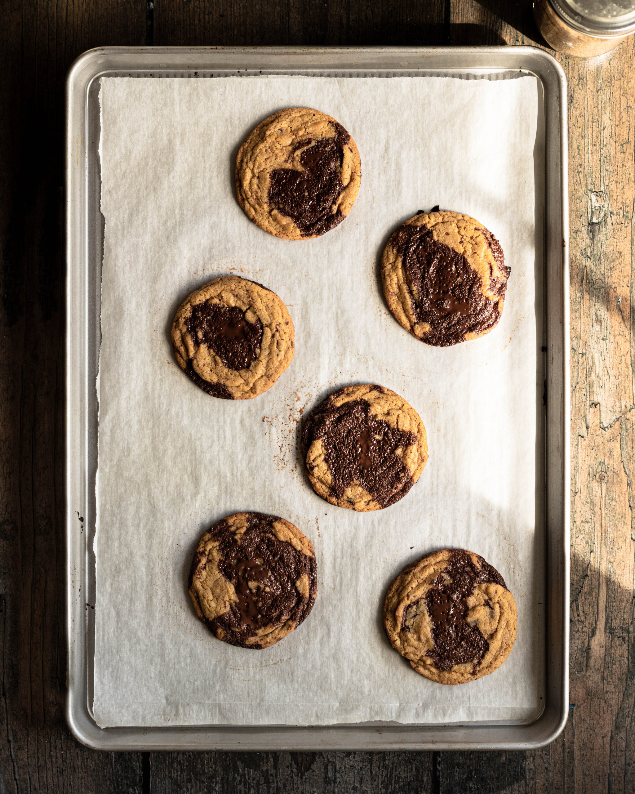Sourdough chocolate chip cookies on a baking sheet