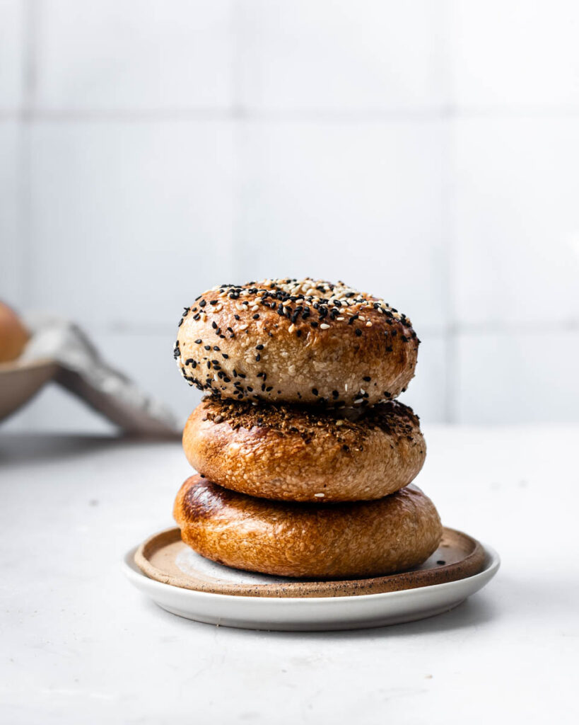 Stack of bagels on plate