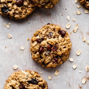 Oatmeal raisin cookie on a piece of parchment paper.