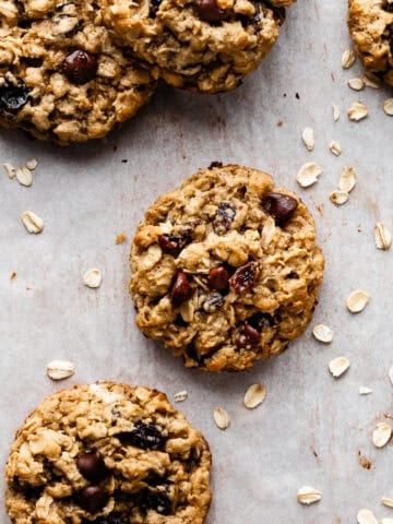 Oatmeal raisin cookie on a piece of parchment paper.