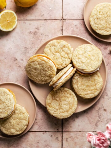 Lemon sandwich cookies on a pink plate