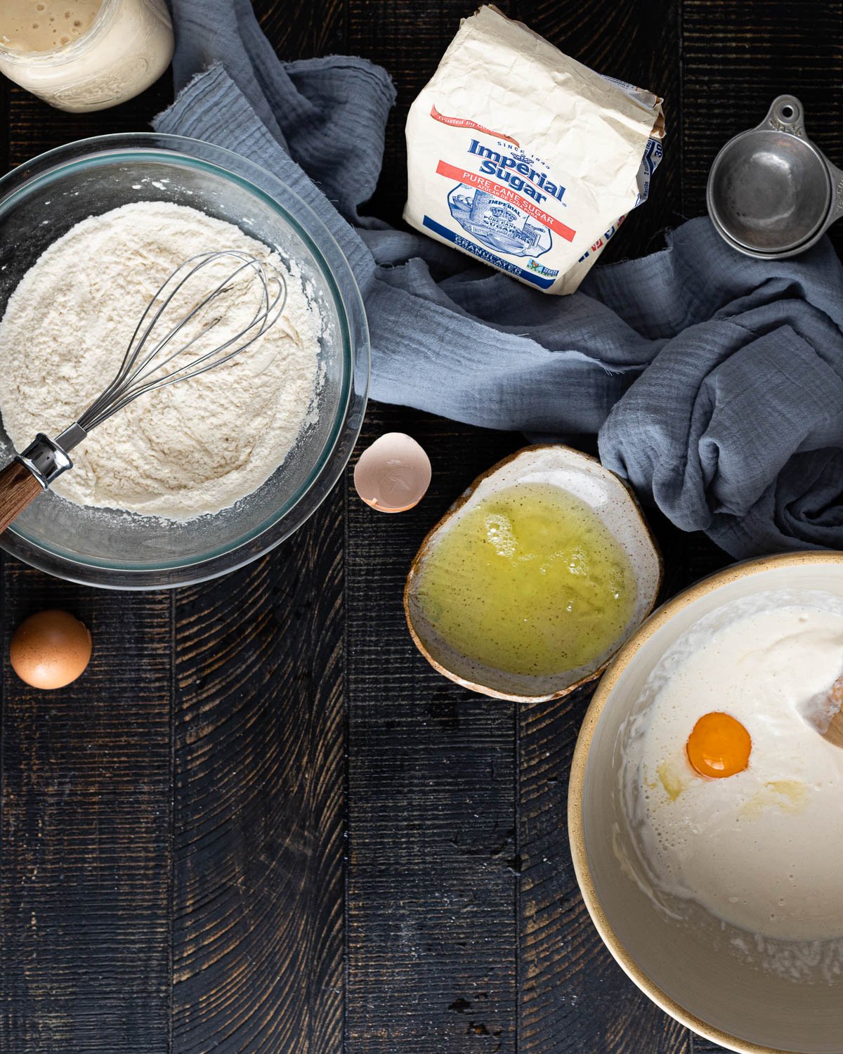 Bowl of flour, egg whites, and pancake batter for pancakes. 