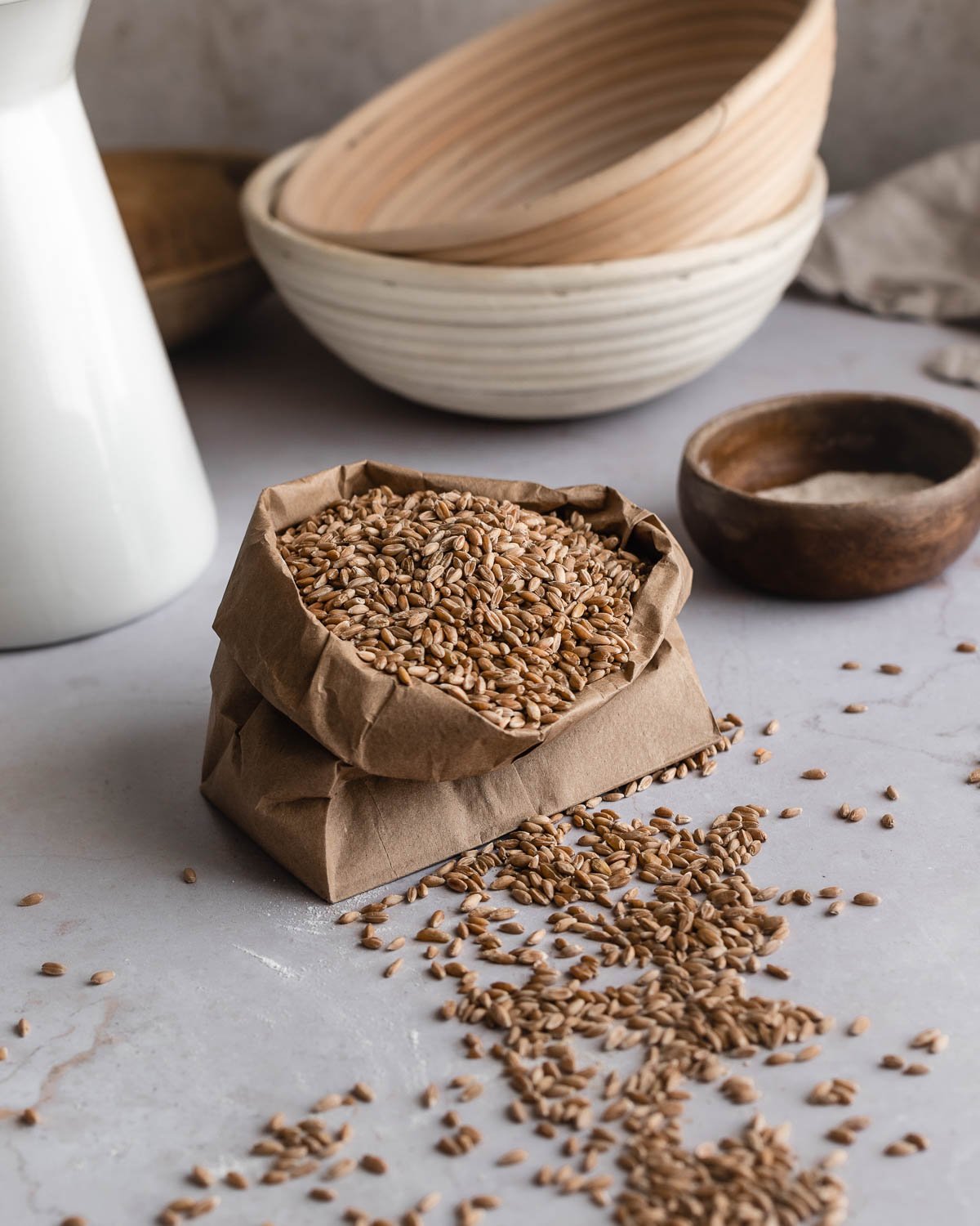 Spelt grains inside a brown paper bag