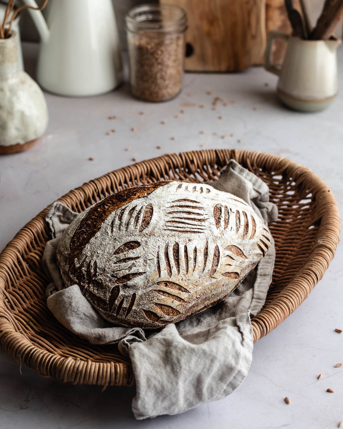 baked loaf of spelt bread on a basket