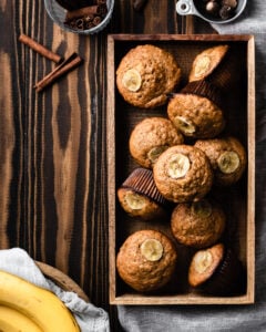 pile of banana muffins in a wood box