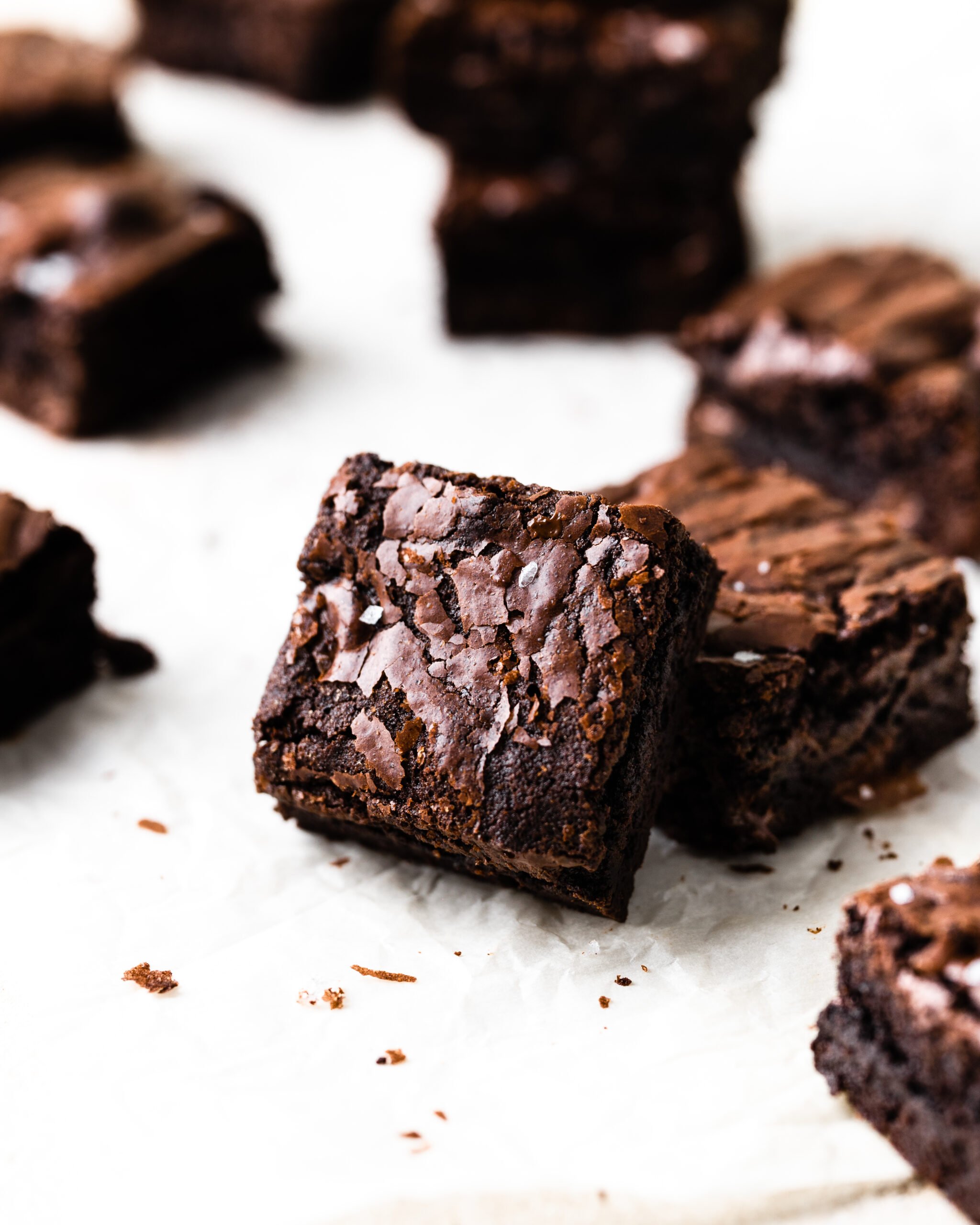 brownie squares on a piece of parchment