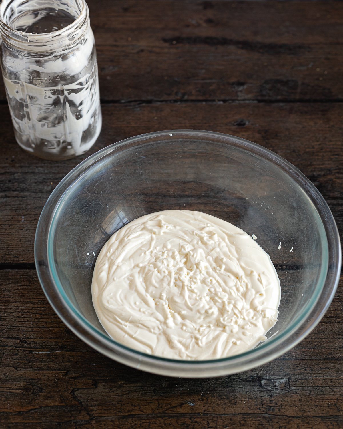 yogurt and cream in a glass bowl