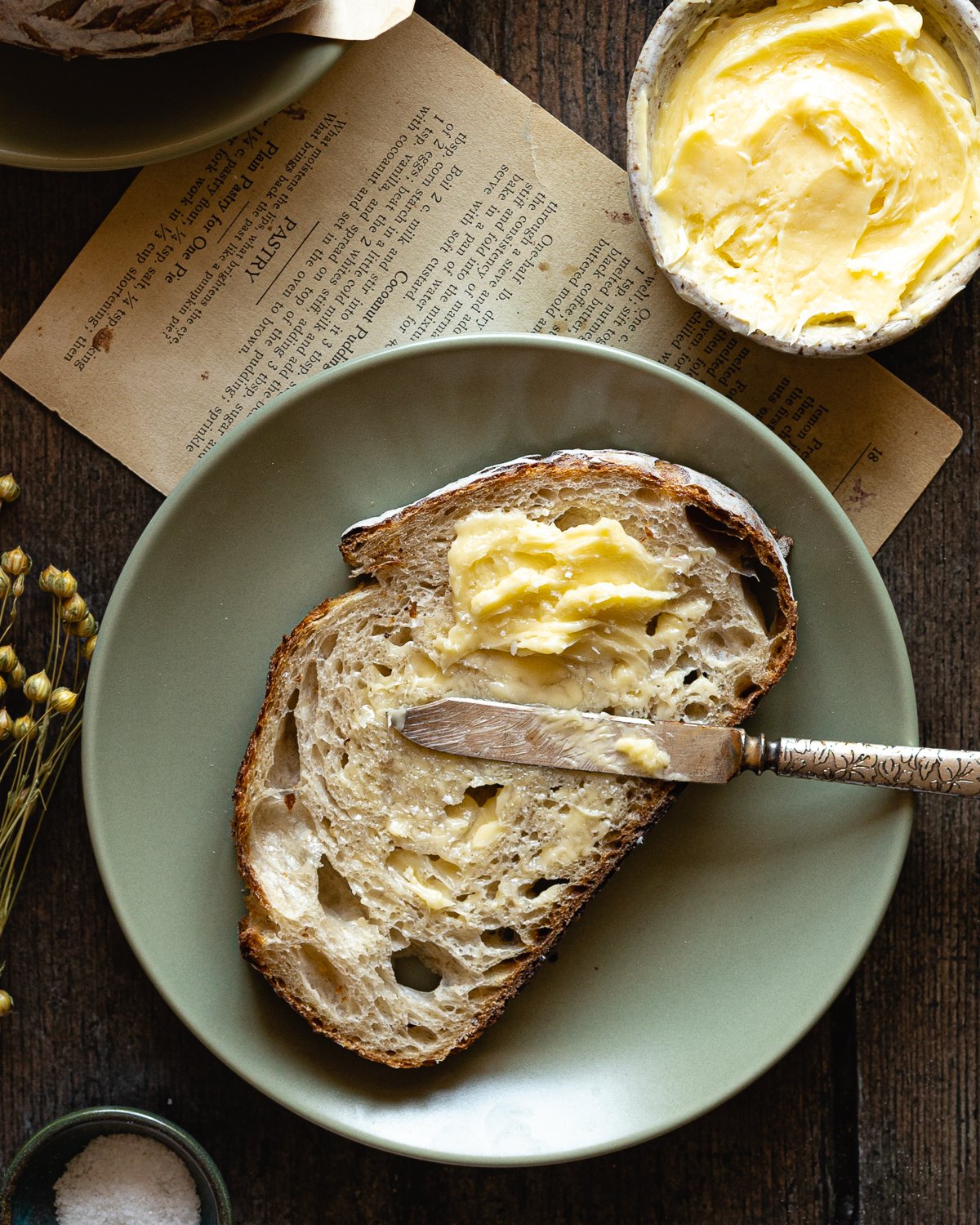 slice of bread with a pat of softened butter