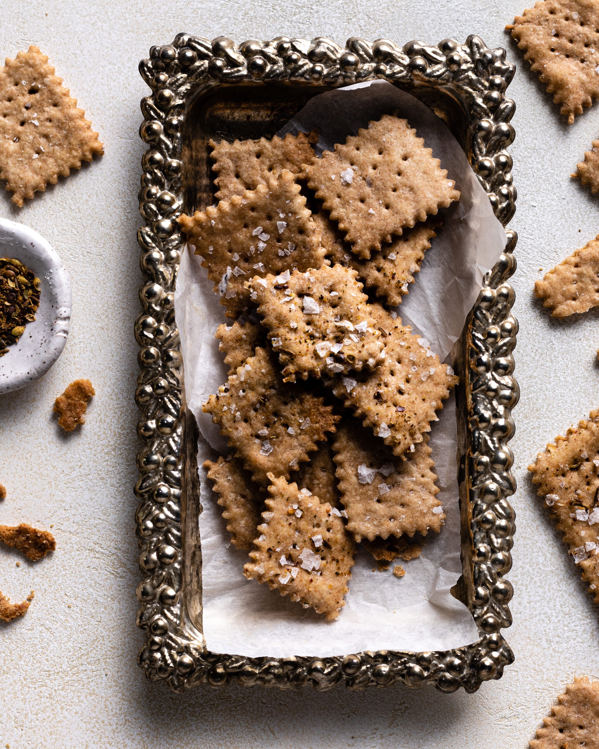 sourdough crackers on a silver platter