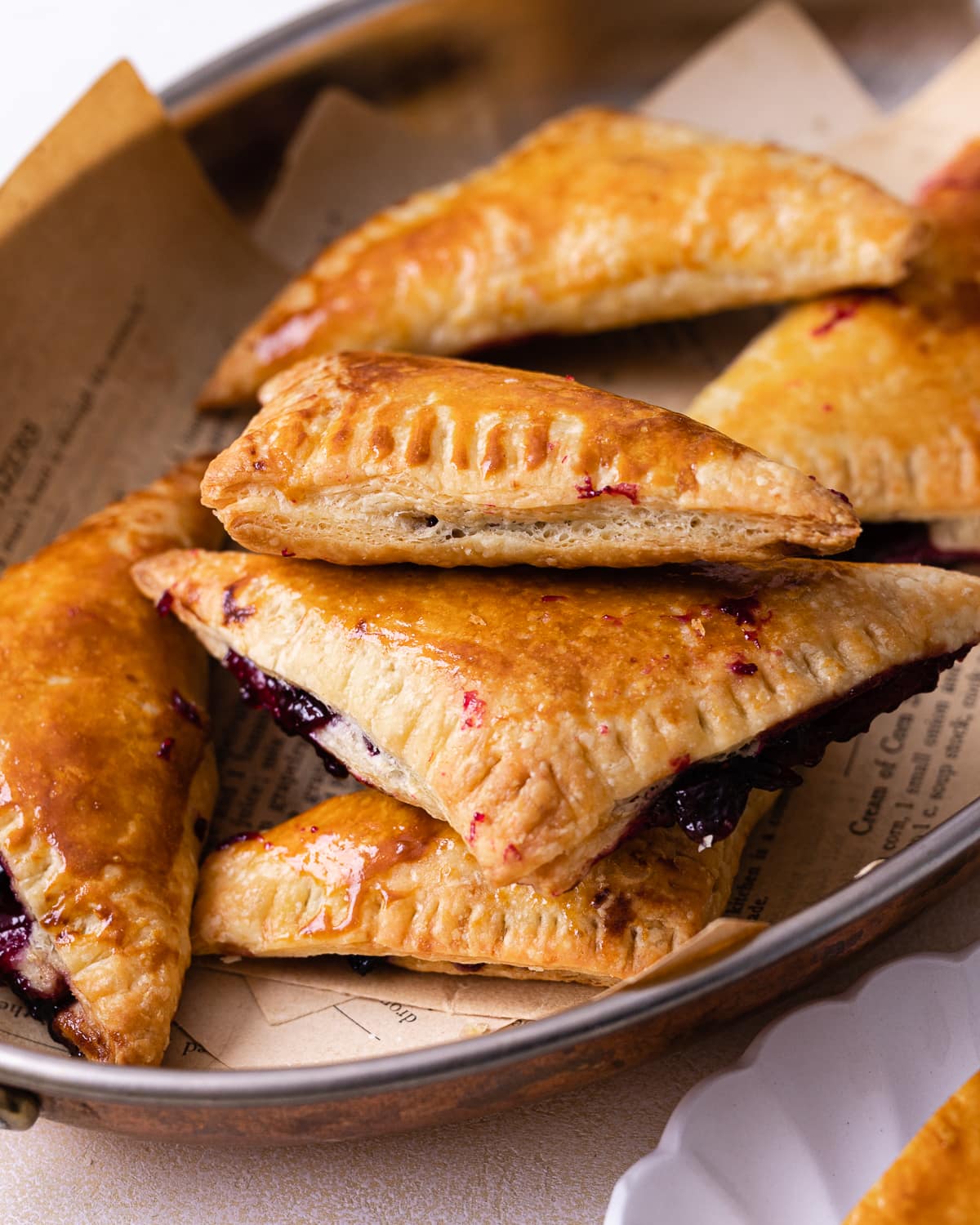 Stack of turnovers on a copper platter