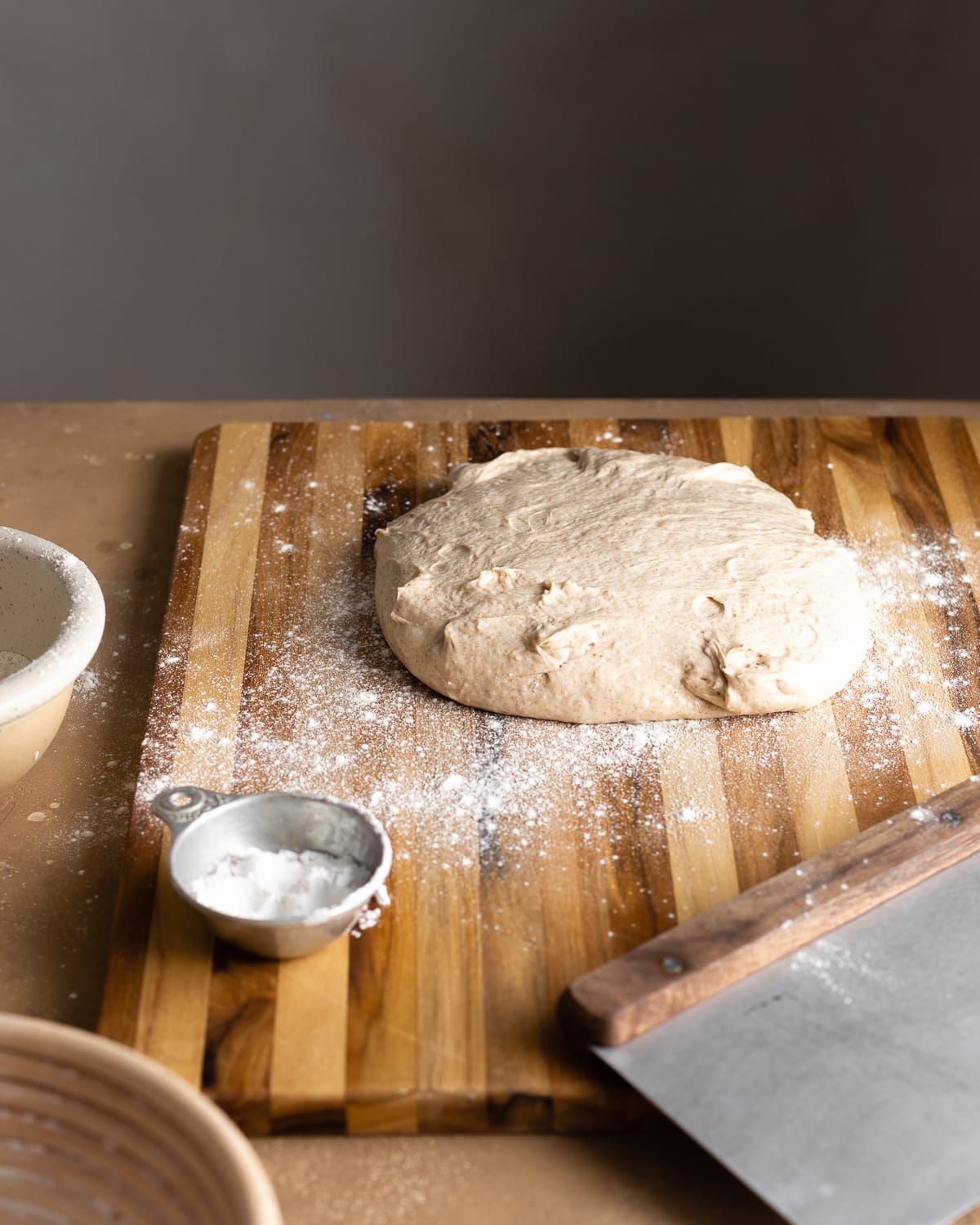 unshaped dough on a wood cutting board