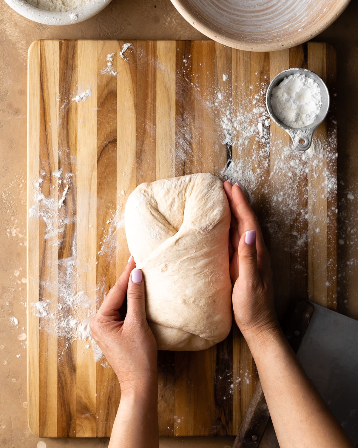 hands shaping dough