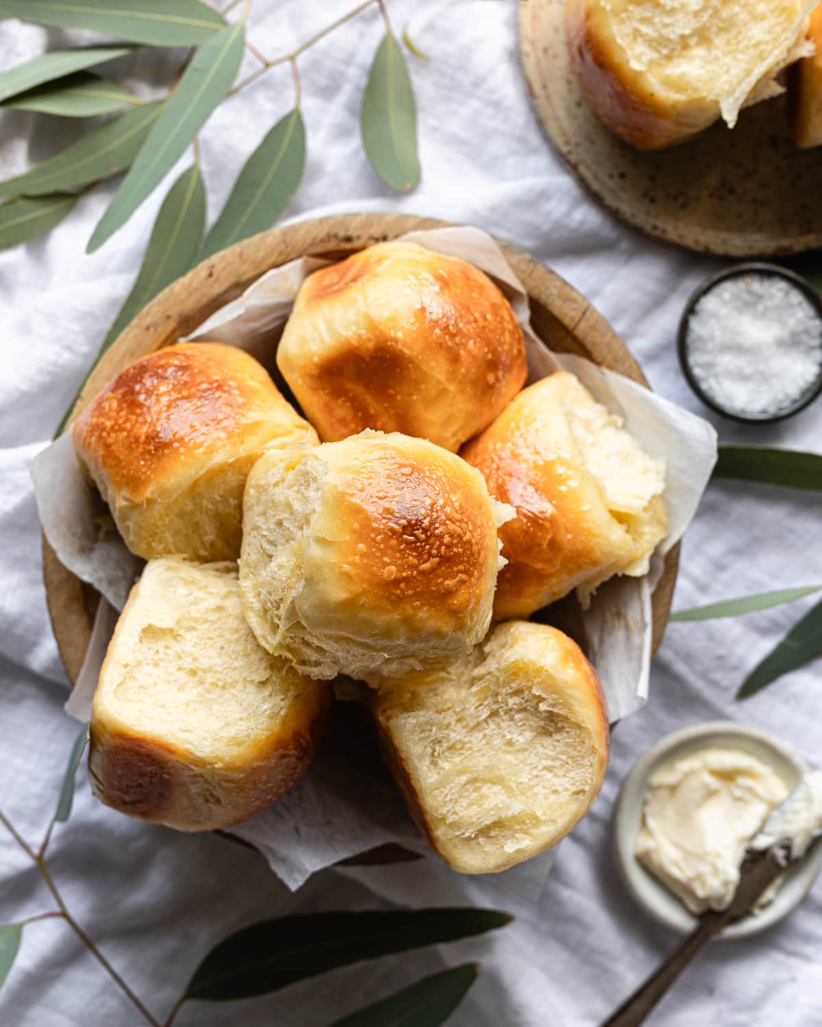 basket of baked rolls in a stack. 