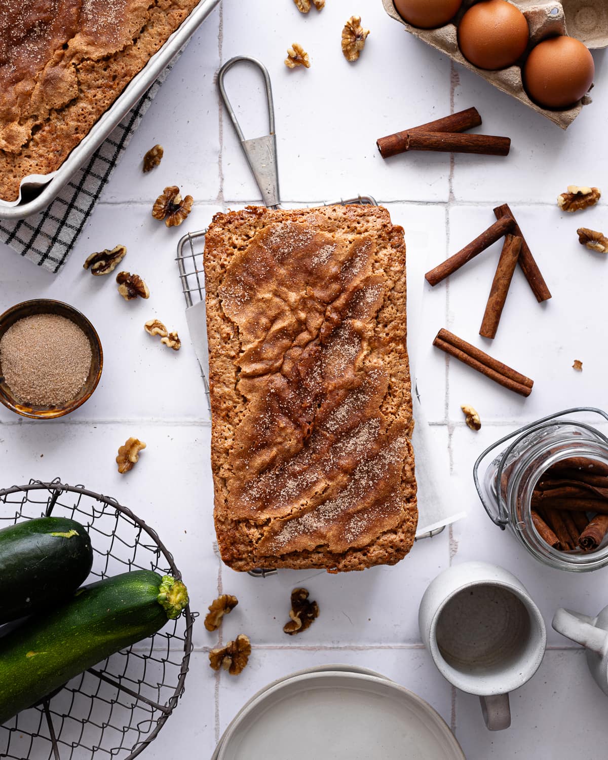 Baked zucchini bread on wire rack. 