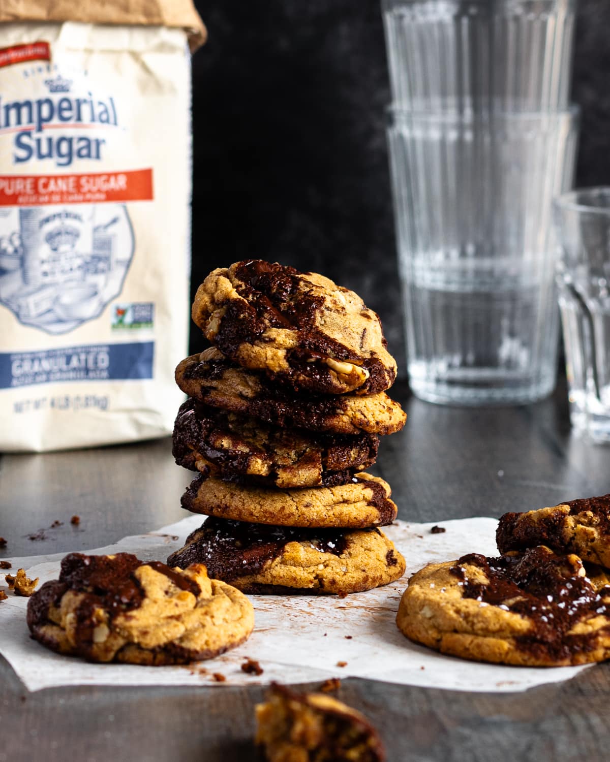 stack of chocolate chip cookies on parchment paper