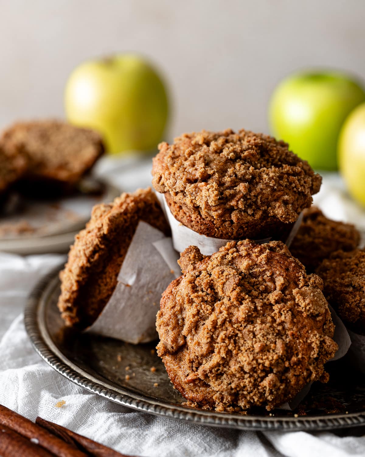 stack of apple muffins on a silver serving tray. 