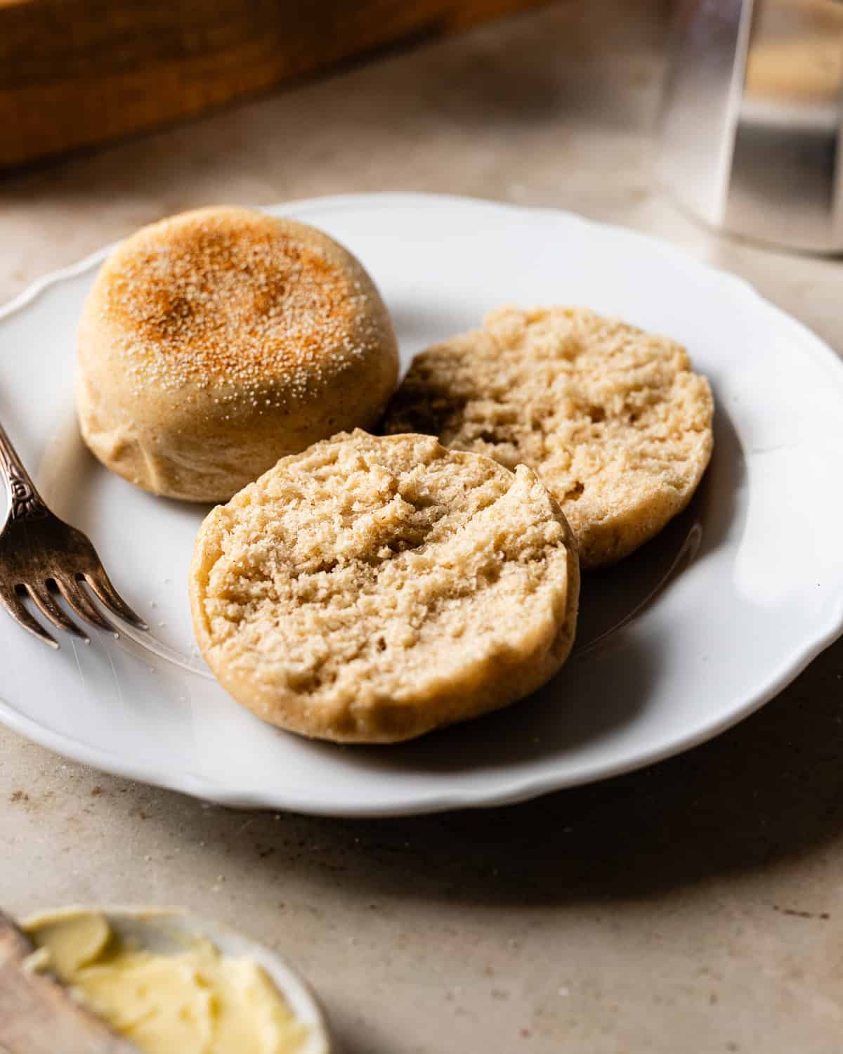 Sliced English muffins on a plate. 