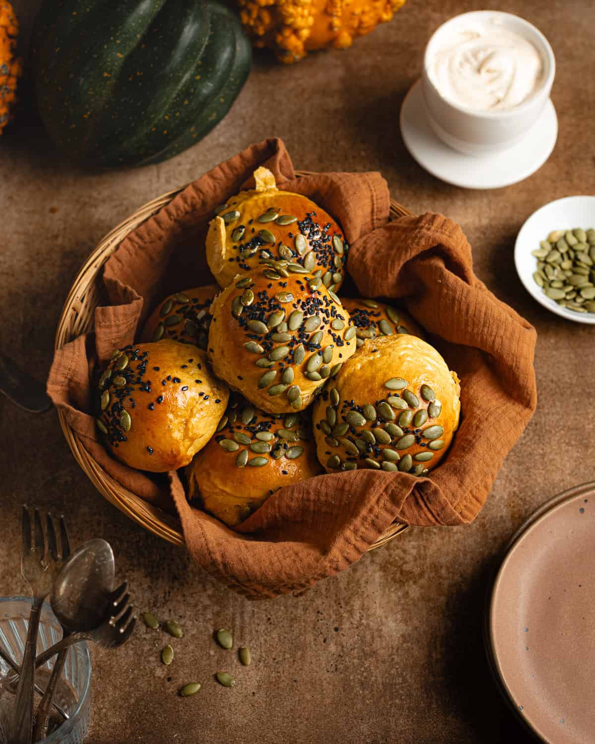 Pumpkin sourdough rolls in a basket. 