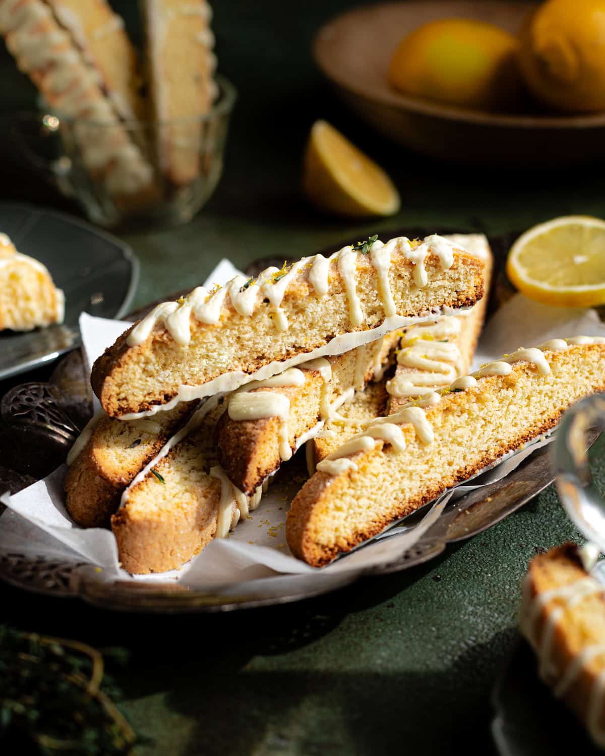 Biscotti stacked on a silver platter.