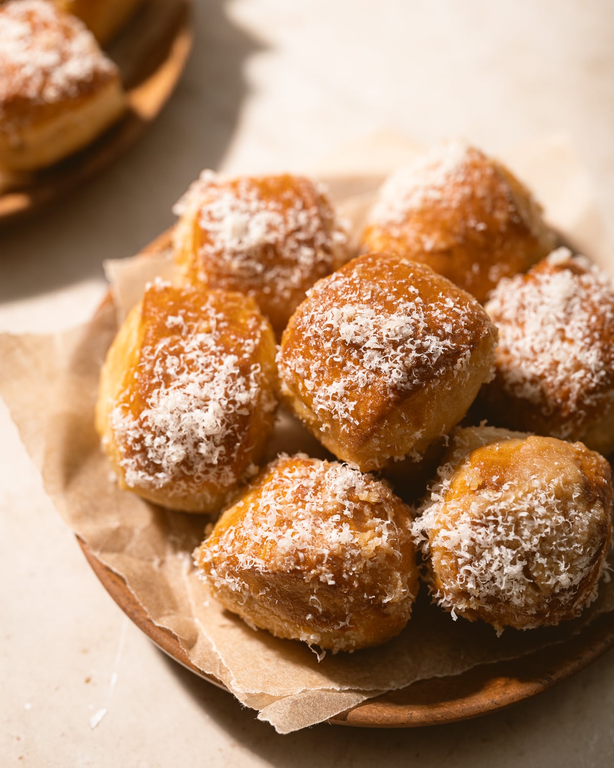 Pile of pretzel bites on a wooden plate. 