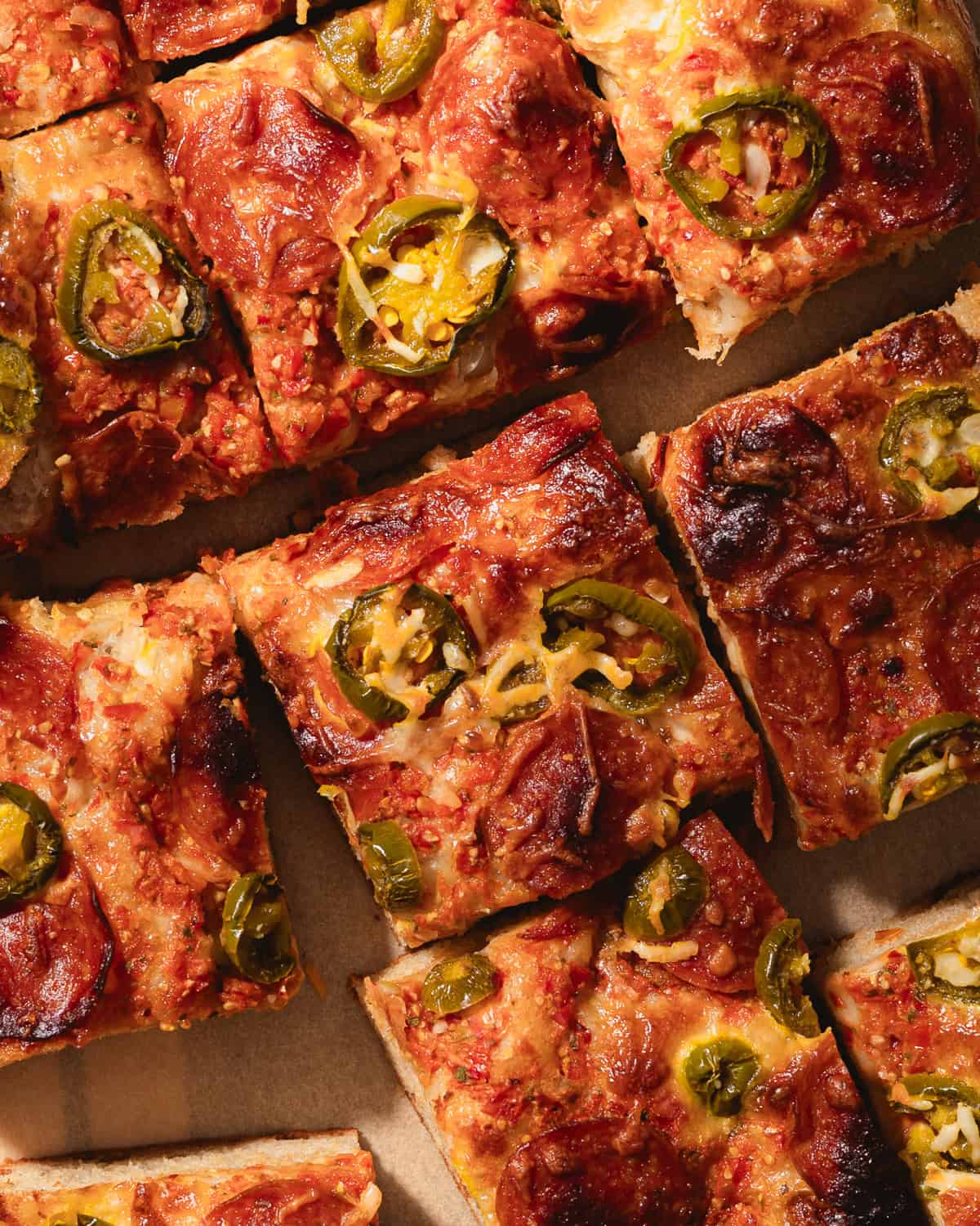 Close up of sliced focaccia pizza. 