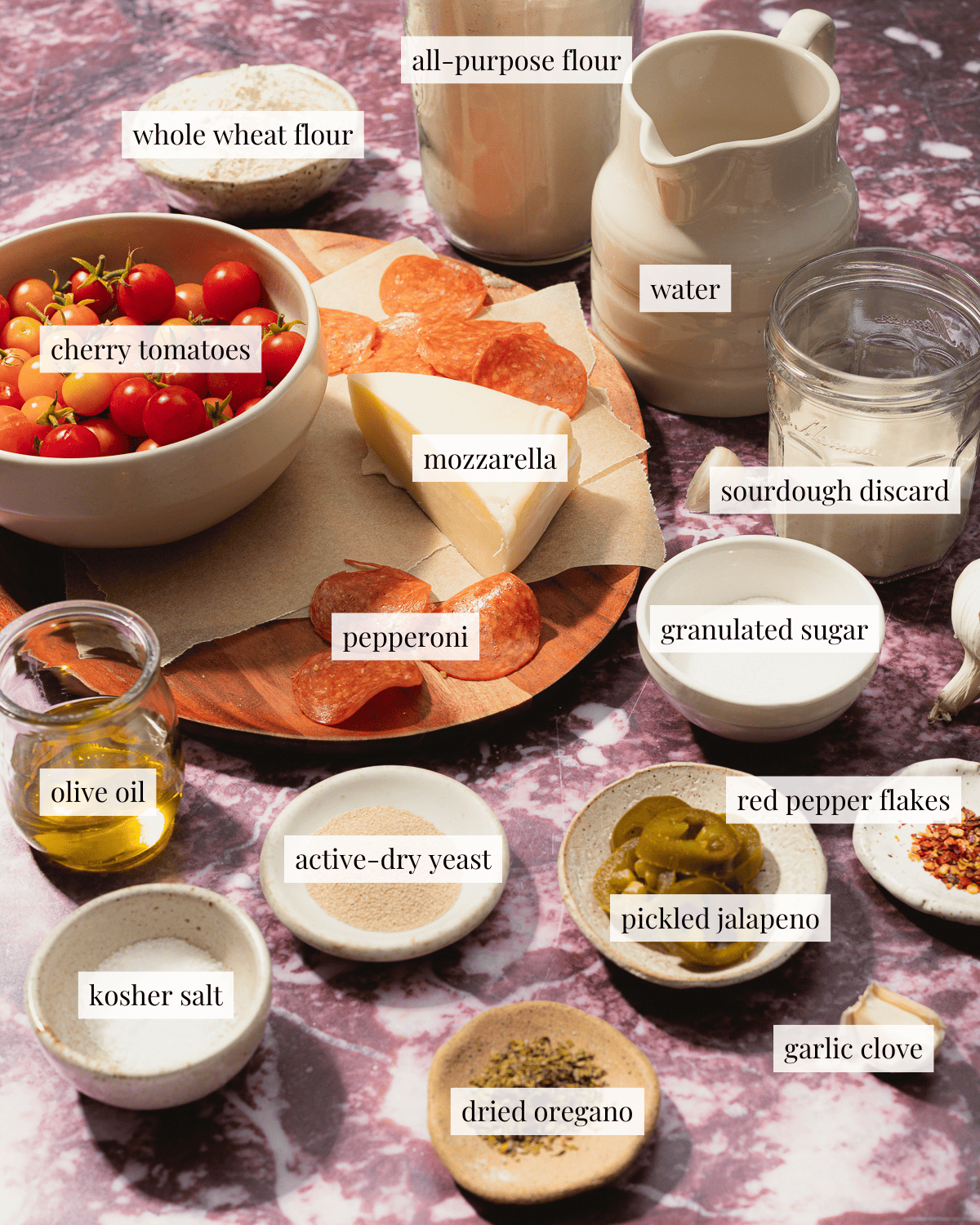 Ingredients for focaccia pizza in various vessels. 